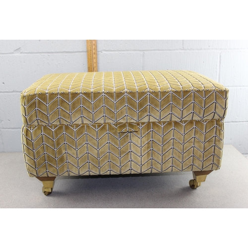 145 - Karki coloured fabric Ottoman on brass castors