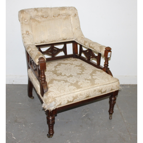 149 - An unusual late Victorian Rosewood ladies armchair with castors