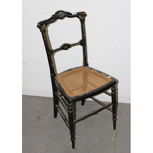 154 - Black lacquered bedside chair with mother of pearl inlay and bergere seat