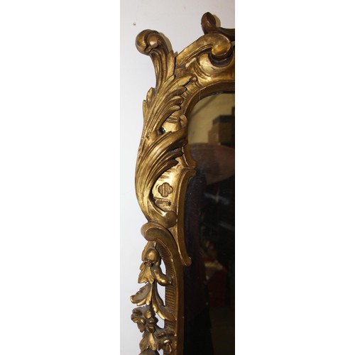 499g - An antique carved giltwood pier mirror, in Louis XV style, likely French 19th century, the frame wit... 