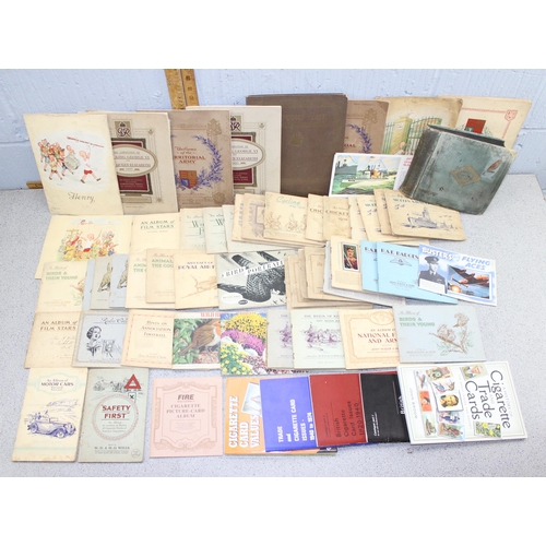 529 - Large quantity of cigarette cards mainly in albums plus a number of related reference books