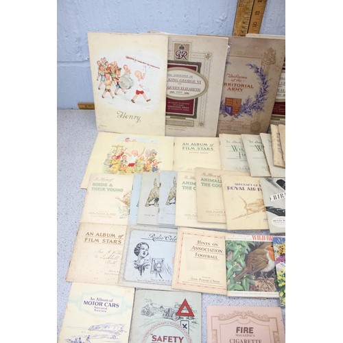 529 - Large quantity of cigarette cards mainly in albums plus a number of related reference books