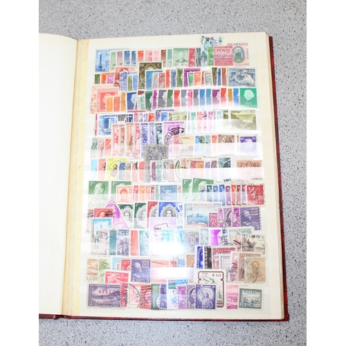 532 - 2 stamp stock books containing mainly foreign stamps & a Liberty stamp album with contents