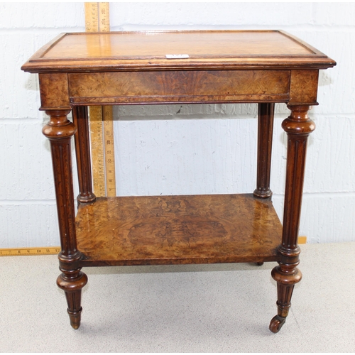 127 - A Victorian walnut two tier stand or side table with integrated drawer on turned column supports wit... 