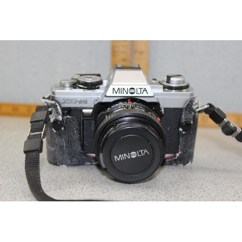 664 - Minolta XG-M camera with 2 lenses and case