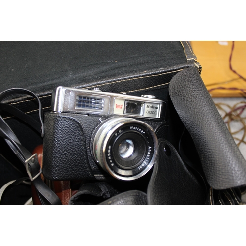 665 - A huge qty of assorted camera related items to inc a Minolta SR-1S, lots of other vintage cameras, p... 