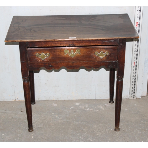 125 - A Georgian oak lowboy with single drawer and brass fittings