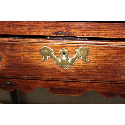 125 - A Georgian oak lowboy with single drawer and brass fittings