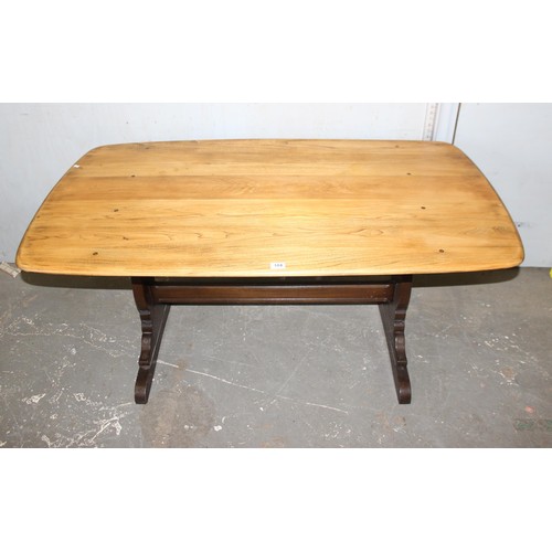 104 - An Ercol refectory table with stripped elm top