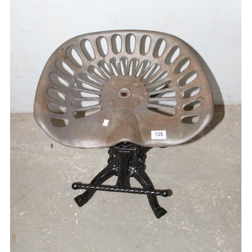 106 - A metal tractor seat style stool