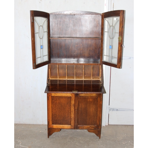 109 - Edwardian oak bureau bookcase with stained glass detail and key