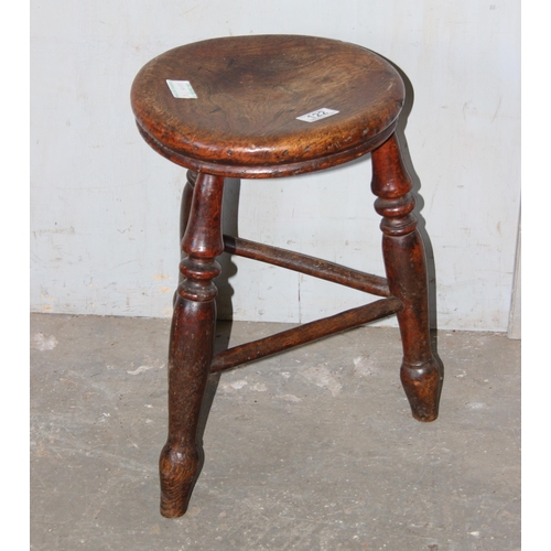 122 - An antique rustic elm stool with tripod base