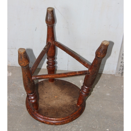 122 - An antique rustic elm stool with tripod base