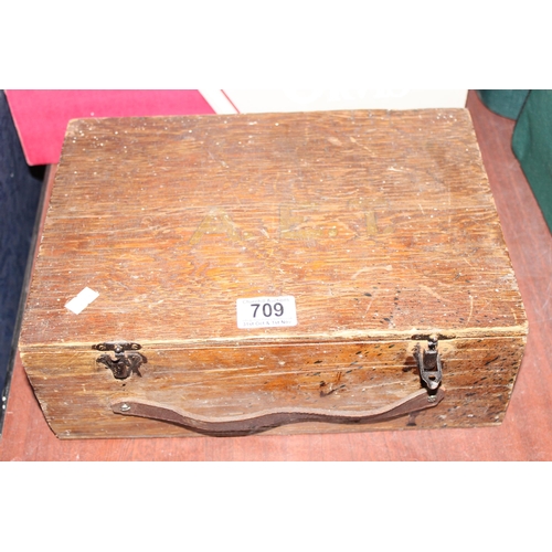 709 - A interesting box of antique and later fishing tackle to include line winders , wooden fishing float... 