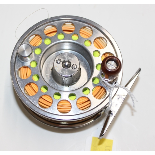 710 - A Redington GD 9/10 & a Pflueger Trion fly fishing reel. Both with reel cases.