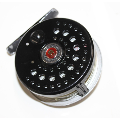 715 - 4 fly fishing reels in carry case along with spare spools and reel cases. Reels include Shakespear S... 