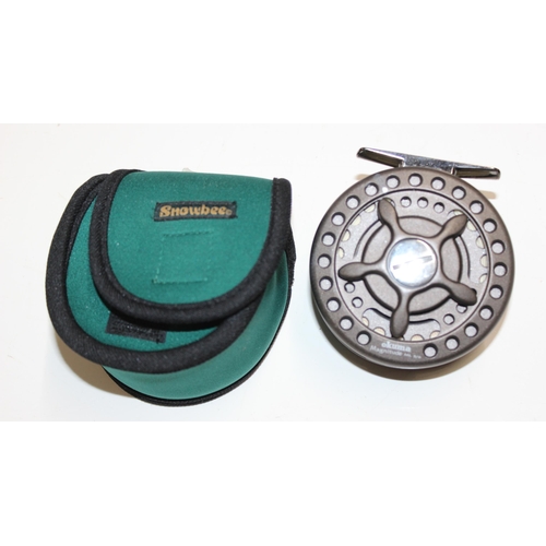 715 - 4 fly fishing reels in carry case along with spare spools and reel cases. Reels include Shakespear S... 