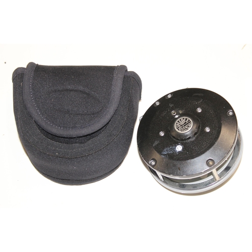 715 - 4 fly fishing reels in carry case along with spare spools and reel cases. Reels include Shakespear S... 