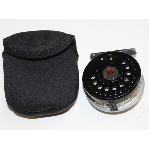 715 - 4 fly fishing reels in carry case along with spare spools and reel cases. Reels include Shakespear S... 