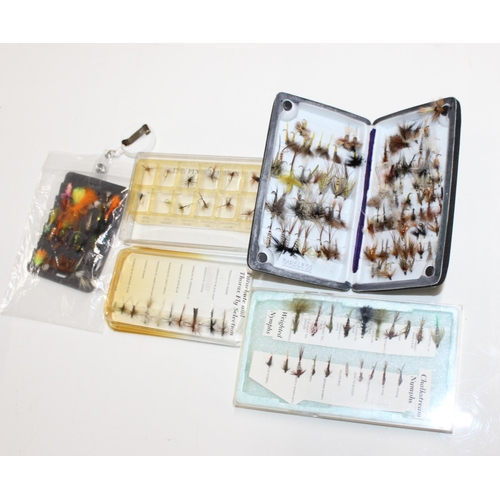 719 - A fantastic collection of hand tied trout fishing flies most in cases