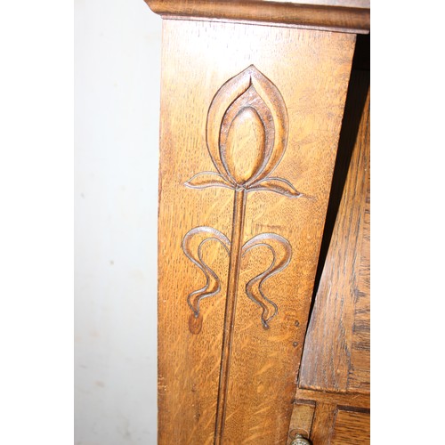 68 - An unusual Art Nouveau oak folding desk with glazed bookcase cabinet to top, bookcase sides and carv... 