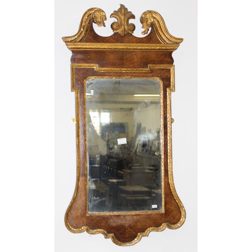 499v - An antique wooden and gilt framed wall mirror, likely 19th century