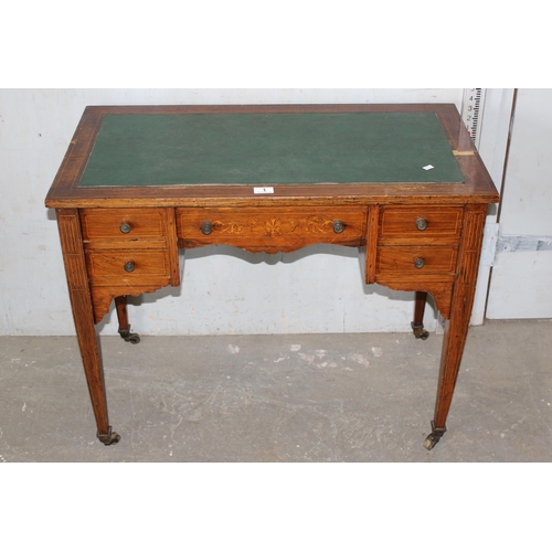 1 - A small Victorian rosewood veneered writing desk with leather top and 5 drawers, inlaid decoration a... 