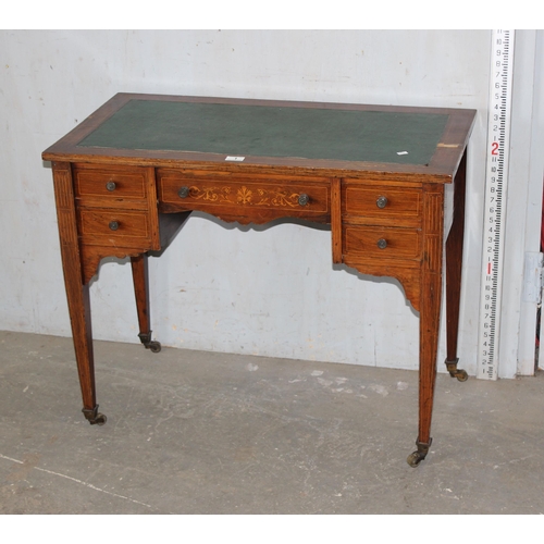 1 - A small Victorian rosewood veneered writing desk with leather top and 5 drawers, inlaid decoration a... 