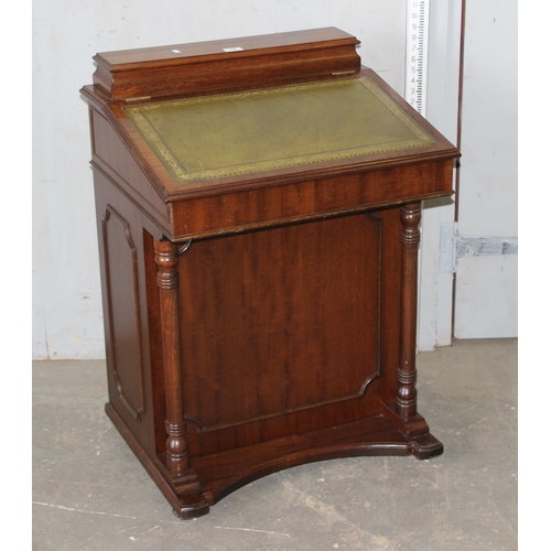 17 - An antique style Davenport desk with leather top