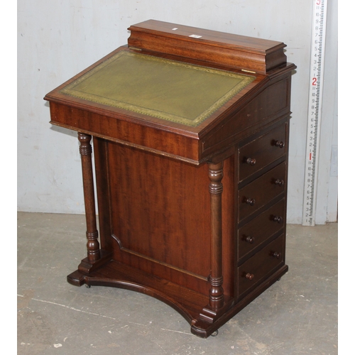 17 - An antique style Davenport desk with leather top