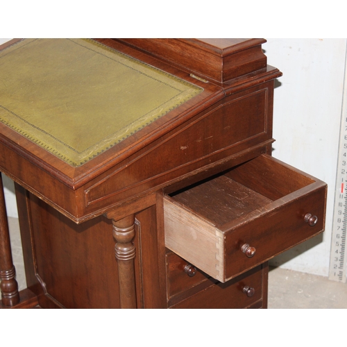 17 - An antique style Davenport desk with leather top