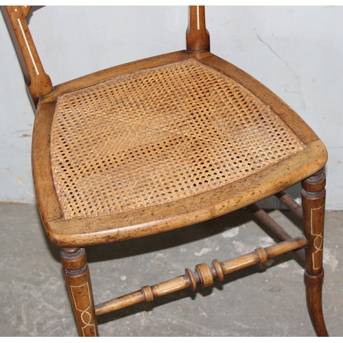 2 - A pair of antique cane seated bedroom chairs with painted details