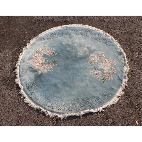 204 - A large blue Chinese superwash rug, round, approx 250cm wide