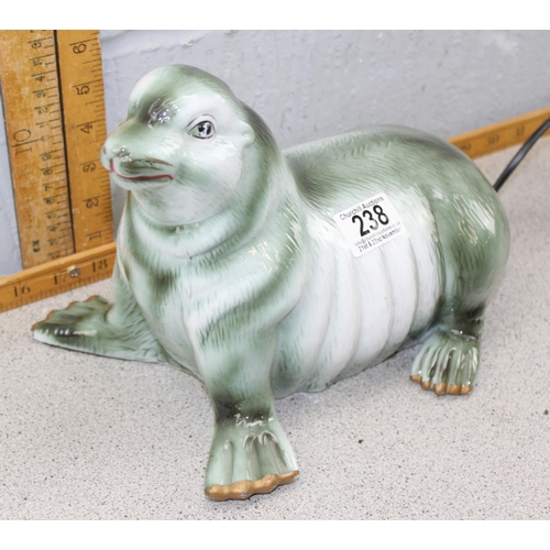 238 - A vintage style pottery lamp formed as a sea lion