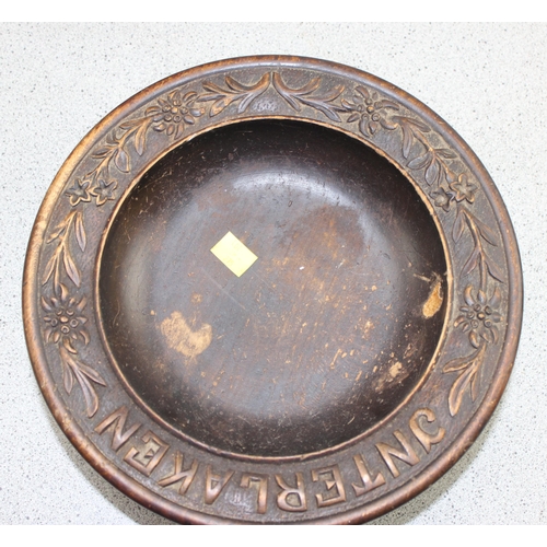 275 - A Black Forest carved wooden musical fruit bowl, a pewter embossed topped bowl and an antique wooden... 