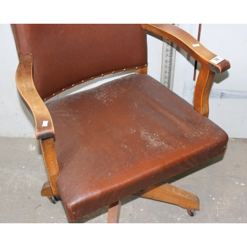 30 - A vintage red upholstered desk chair, Art Deco period