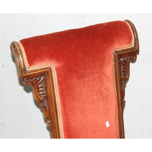 6 - A matched pair of antique Prie Dieu chairs with dark salmon coloured upholstery