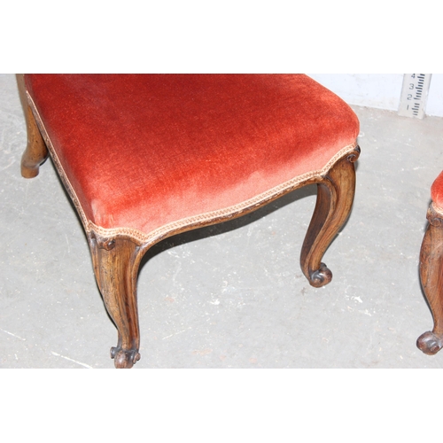 6 - A matched pair of antique Prie Dieu chairs with dark salmon coloured upholstery