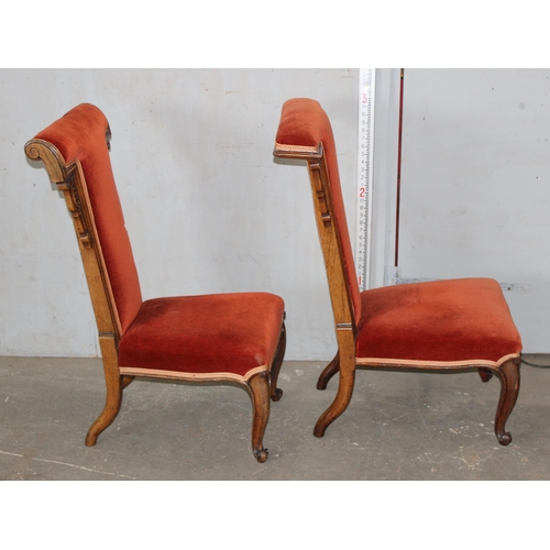 6 - A matched pair of antique Prie Dieu chairs with dark salmon coloured upholstery