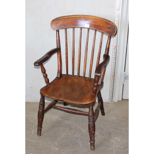 71 - An antique stickback farmhouse armchair with elm seat