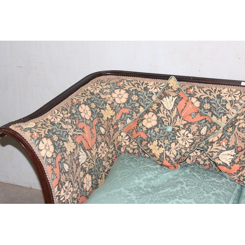 8 - An antique wooden framed couch or love seat with carved details and William Morris style upholstery ... 