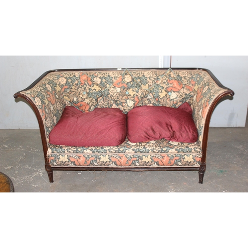 8 - An antique wooden framed couch or love seat with carved details and William Morris style upholstery ... 