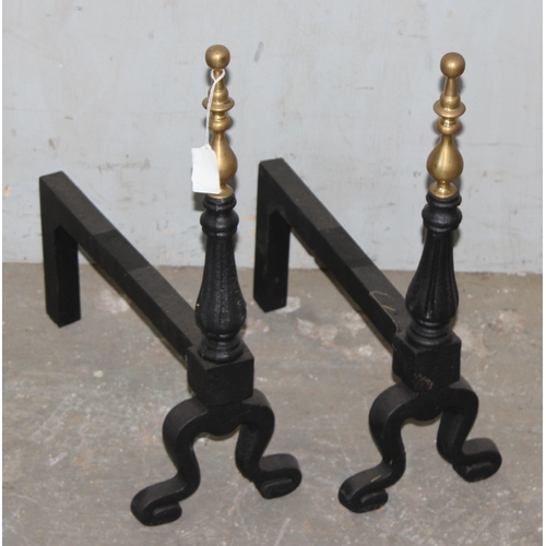 92 - Pair of cast iron firedogs with gilt finials