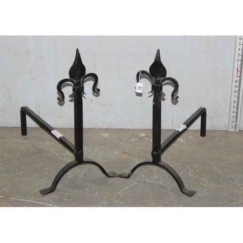 93 - Pair of cast iron firedogs with hammered Fleur de Lis