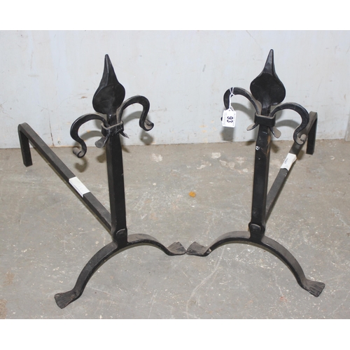 93 - Pair of cast iron firedogs with hammered Fleur de Lis