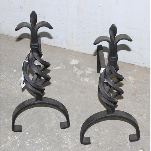 95 - Pair of cast iron firedogs with twisted Fleur de Lis design