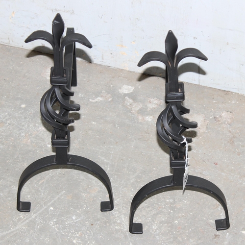 96 - Pair of cast iron firedogs with twisted Fleur de Lis design