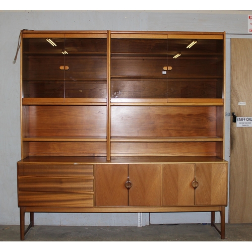 131 - A vintage A.H McIntosh & Co Ltd 3 drawer & 2 cupboard sideboard with display case.