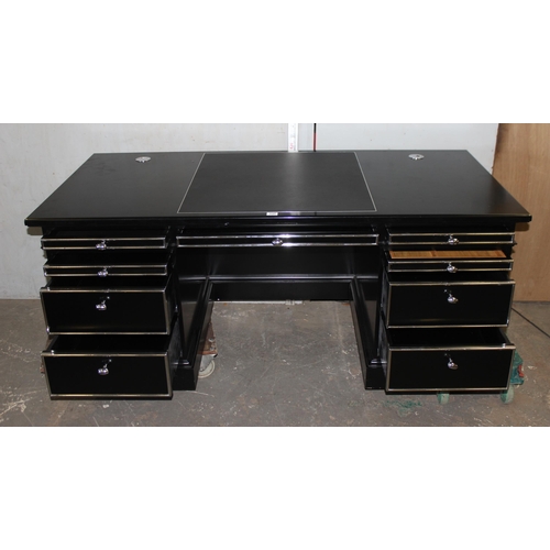 137 - An extremely impressive large black and silver gilt desk, with leather top insert.