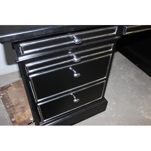 137 - An extremely impressive large black and silver gilt desk, with leather top insert.